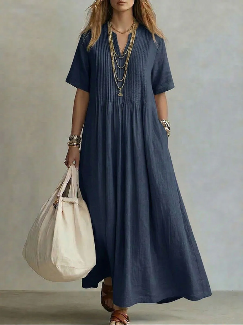 Noor — El Vestido de Drapé Plisado